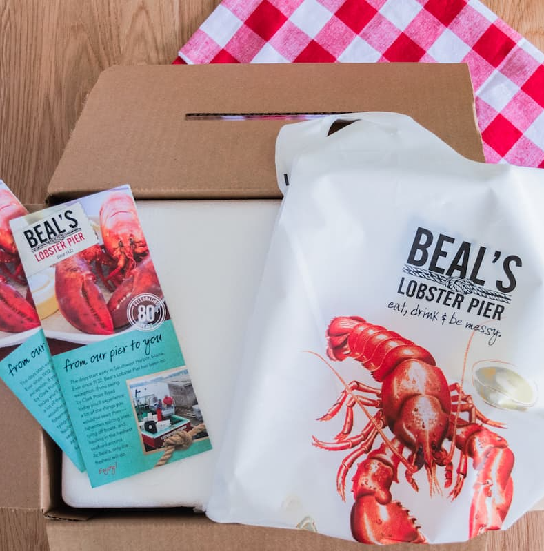 An opened box from Beal's Lobster Pier contains crisp and clean materials.