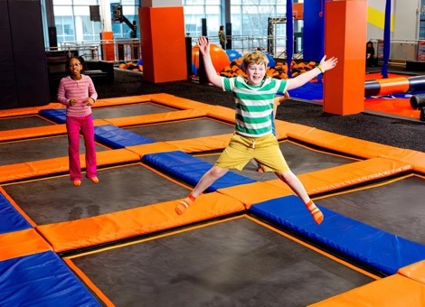 Child jumping at a Sky Zone trampoline park